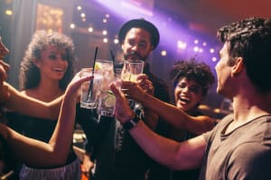 friends drinking spirits in nightclub VIP concept
