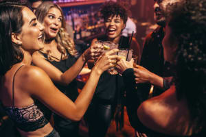 friends drinking in nightclub together VIP
