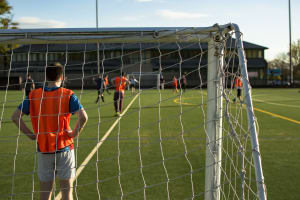 Five-A-Side Football group of guys playing football focus on gatekeeper