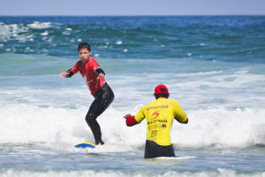 A man taking a surfing lesson