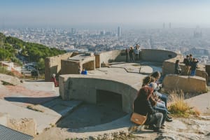 *EDITORIAL USE*  People watching panorama of Barcelona form the hill known as the Turo de la Rovira