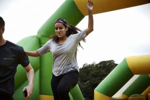Inflatable assault course woman and man