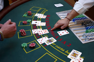 People playing blackjack at the casino table