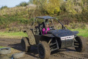A woman having fun in an off road buggy