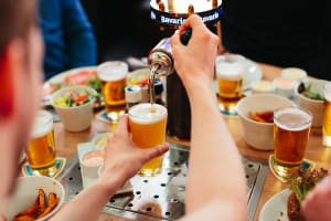 Tap & Dine Amsterdam table with beer pouring and meal