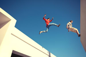 Stunt man activity jumping between buildings