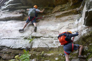 group of guys rock climbing
