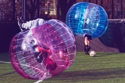 two guys playing zorb football