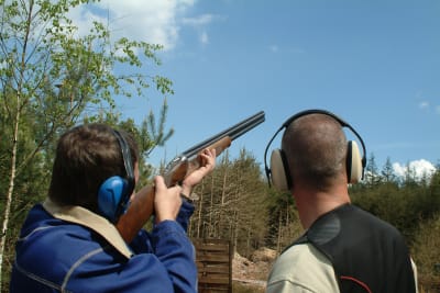 Man shooting gun during clay pigeon event