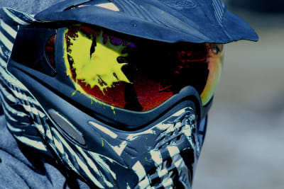 A man in a paintball mask
