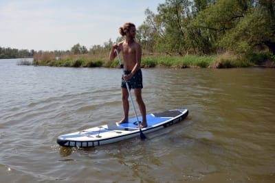 man doing Stand Up Paddleboarding