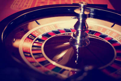 A spinning roulette wheel in a nightclub