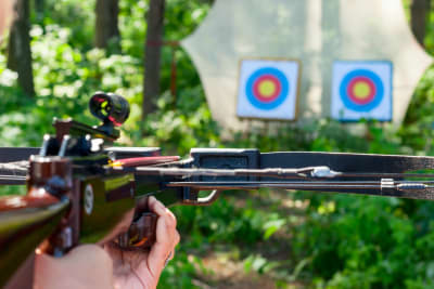 Woman shooting crossbow
