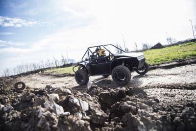 An image of a man driving an off road buggy