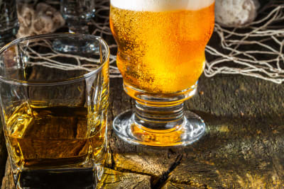 Whiskey and Beer on wooden barrel